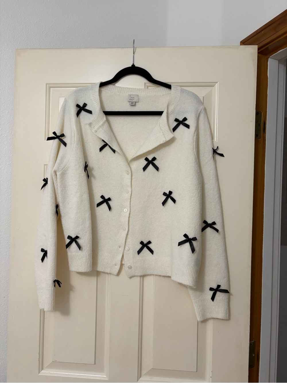 a new day Cream Cardigan with Black Bow Accents